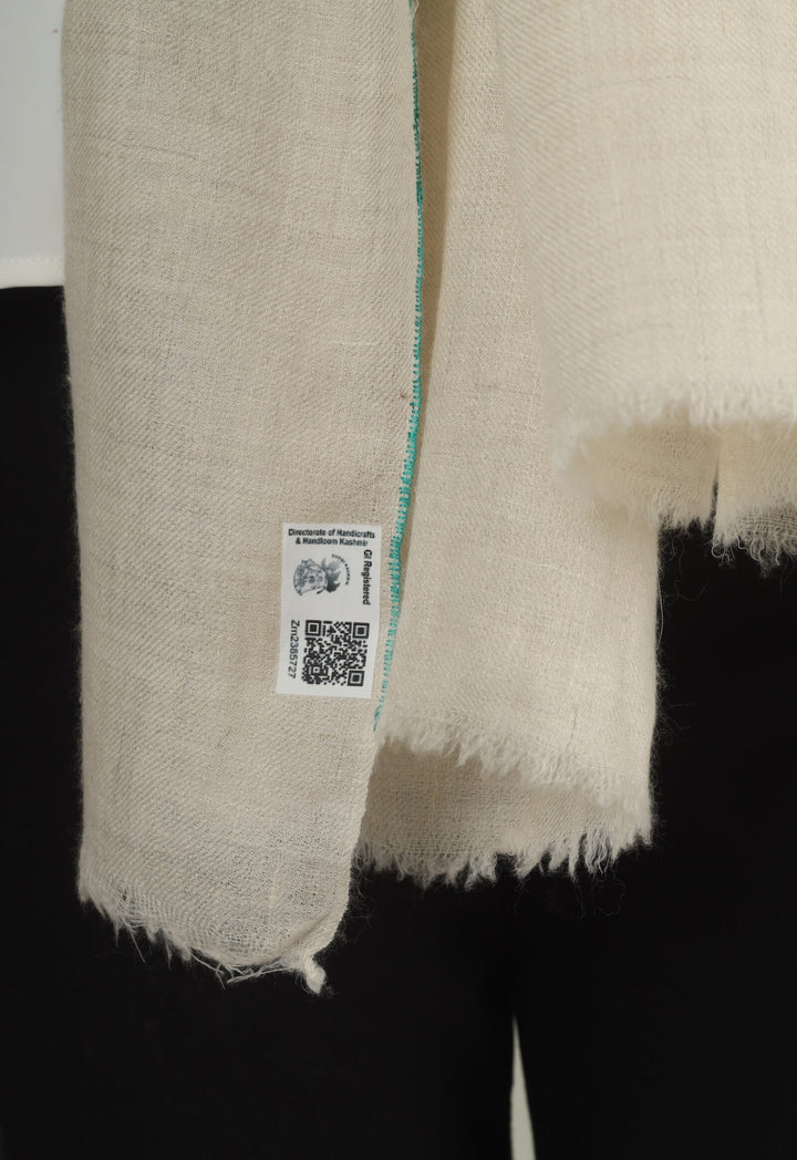 Close-up of a white GI Kashmiri Pure Pashmina stole with turquoise-green floral jaal Sozni embroidery knotted at the front over a white shirt.
    
      | pashmina shawls online | authentic Kashmiri pashmina shawl online | pure pashmina shawl online | original GI certified pashmina shawl online | luxury men's pashmina shawl online from Kashmir | where to buy online pure pashmina in India
    
    | GI Tag Certified - Government-verified authentic Kashmiri Pashmina
    | G20 Official Partner - Selected by India for G20 Summit gifting
    | Handicraft Registered - Official recognition of traditional craftsmanship
    | Certificate of Authenticity - Every purchase includes GI certification