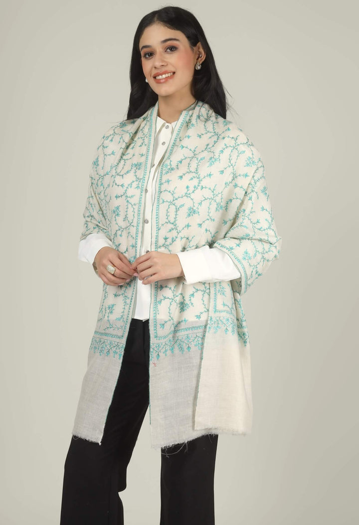 Close-up of a white GI Kashmiri Pure Pashmina stole with turquoise-green floral jaal Sozni embroidery knotted at the front over a white shirt.
    
      | pashmina shawls online | authentic Kashmiri pashmina shawl online | pure pashmina shawl online | original GI certified pashmina shawl online | luxury men's pashmina shawl online from Kashmir | where to buy online pure pashmina in India
    
    | GI Tag Certified - Government-verified authentic Kashmiri Pashmina
    | G20 Official Partner - Selected by India for G20 Summit gifting
    | Handicraft Registered - Official recognition of traditional craftsmanship
    | Certificate of Authenticity - Every purchase includes GI certification