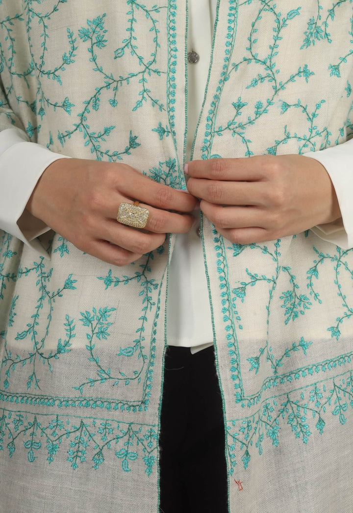 Close-up of a white GI Kashmiri Pure Pashmina stole with turquoise-green floral jaal Sozni embroidery knotted at the front over a white shirt.
    
      | pashmina shawls online | authentic Kashmiri pashmina shawl online | pure pashmina shawl online | original GI certified pashmina shawl online | luxury men's pashmina shawl online from Kashmir | where to buy online pure pashmina in India
    
    | GI Tag Certified - Government-verified authentic Kashmiri Pashmina
    | G20 Official Partner - Selected by India for G20 Summit gifting
    | Handicraft Registered - Official recognition of traditional craftsmanship
    | Certificate of Authenticity - Every purchase includes GI certification