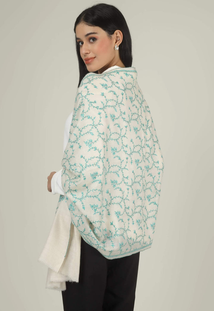 Close-up of a white GI Kashmiri Pure Pashmina stole with turquoise-green floral jaal Sozni embroidery knotted at the front over a white shirt.
    
      | pashmina shawls online | authentic Kashmiri pashmina shawl online | pure pashmina shawl online | original GI certified pashmina shawl online | luxury men's pashmina shawl online from Kashmir | where to buy online pure pashmina in India
    
    | GI Tag Certified - Government-verified authentic Kashmiri Pashmina
    | G20 Official Partner - Selected by India for G20 Summit gifting
    | Handicraft Registered - Official recognition of traditional craftsmanship
    | Certificate of Authenticity - Every purchase includes GI certification