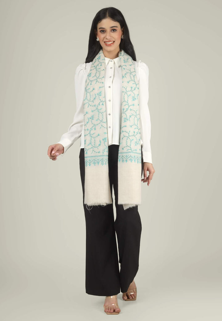 Close-up of a white GI Kashmiri Pure Pashmina stole with turquoise-green floral jaal Sozni embroidery knotted at the front over a white shirt.
    
      | pashmina shawls online | authentic Kashmiri pashmina shawl online | pure pashmina shawl online | original GI certified pashmina shawl online | luxury men's pashmina shawl online from Kashmir | where to buy online pure pashmina in India
    
    | GI Tag Certified - Government-verified authentic Kashmiri Pashmina
    | G20 Official Partner - Selected by India for G20 Summit gifting
    | Handicraft Registered - Official recognition of traditional craftsmanship
    | Certificate of Authenticity - Every purchase includes GI certification