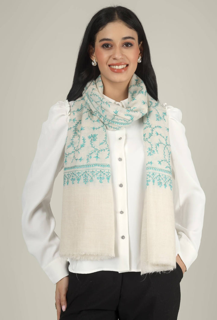 Close-up of a white GI Kashmiri Pure Pashmina stole with turquoise-green floral jaal Sozni embroidery knotted at the front over a white shirt.
    
      | pashmina shawls online | authentic Kashmiri pashmina shawl online | pure pashmina shawl online | original GI certified pashmina shawl online | luxury men's pashmina shawl online from Kashmir | where to buy online pure pashmina in India
    
    | GI Tag Certified - Government-verified authentic Kashmiri Pashmina
    | G20 Official Partner - Selected by India for G20 Summit gifting
    | Handicraft Registered - Official recognition of traditional craftsmanship
    | Certificate of Authenticity - Every purchase includes GI certification