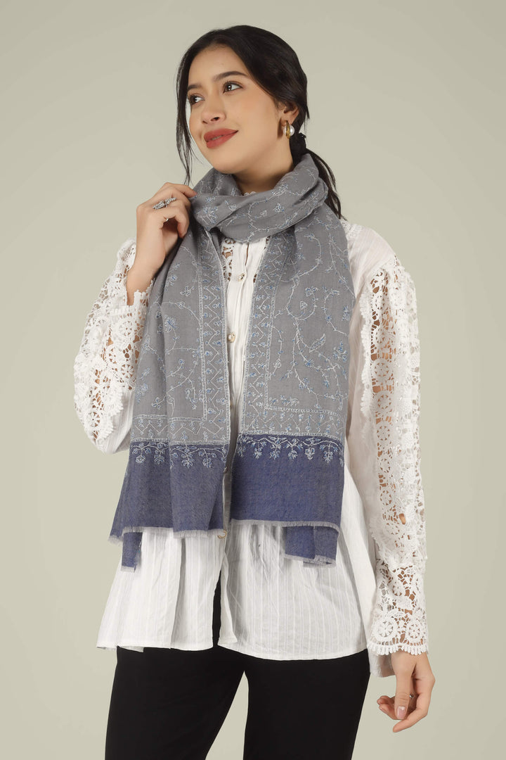 Hand-embroidered grey and navy-blue dual-tone pure Pashmina stole featuring an all-over sky-blue Jaldaar Sozni floral vine pattern from Kepra.
    
      | pashmina shawls online | authentic Kashmiri pashmina shawl online | pure pashmina shawl online | original GI certified pashmina shawl online | luxury men's pashmina shawl online from Kashmir | where to buy online pure pashmina in India
    
    | GI Tag Certified - Government-verified authentic Kashmiri Pashmina
    | G20 Official Partner - Selected by India for G20 Summit gifting
    | Handicraft Registered - Official recognition of traditional craftsmanship
    | Certificate of Authenticity - Every purchase includes GI certification