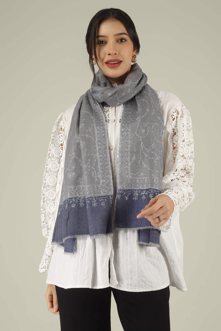 Hand-embroidered grey and navy-blue dual-tone pure Pashmina stole featuring an all-over sky-blue Jaldaar Sozni floral vine pattern from Kepra.
    
      | pashmina shawls online | authentic Kashmiri pashmina shawl online | pure pashmina shawl online | original GI certified pashmina shawl online | luxury men's pashmina shawl online from Kashmir | where to buy online pure pashmina in India
    
    | GI Tag Certified - Government-verified authentic Kashmiri Pashmina
    | G20 Official Partner - Selected by India for G20 Summit gifting
    | Handicraft Registered - Official recognition of traditional craftsmanship
    | Certificate of Authenticity - Every purchase includes GI certification