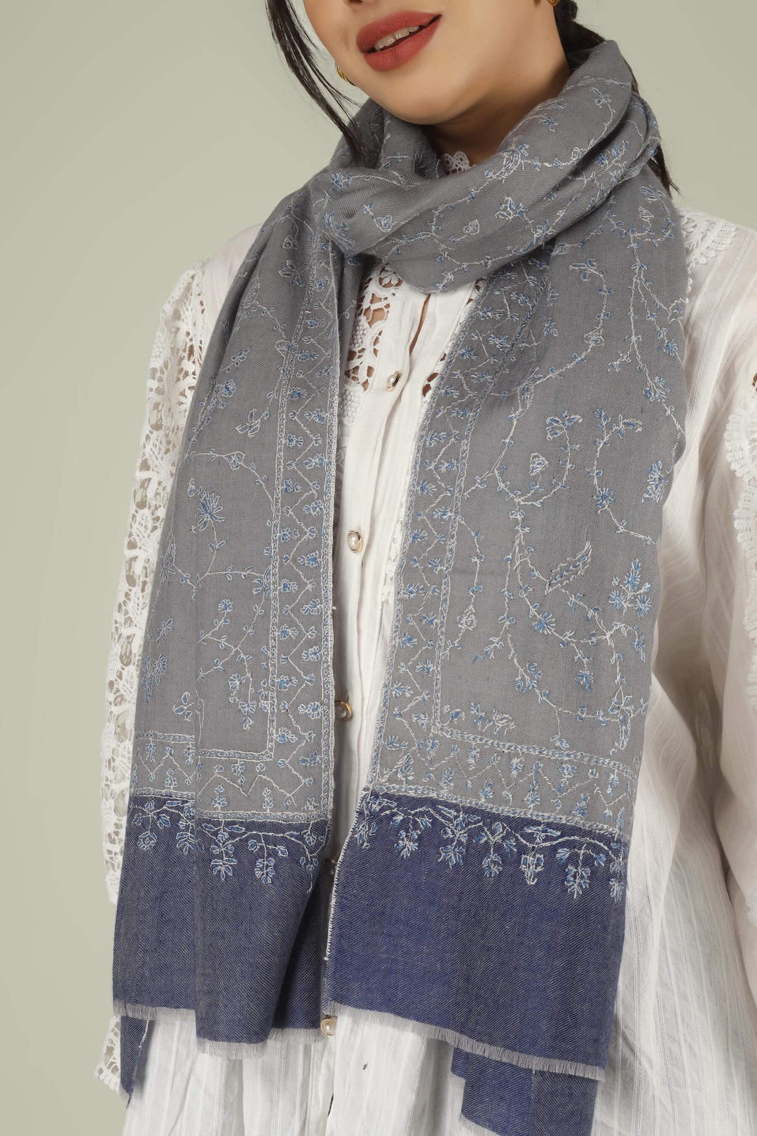Hand-embroidered grey and navy-blue dual-tone pure Pashmina stole featuring an all-over sky-blue Jaldaar Sozni floral vine pattern from Kepra.