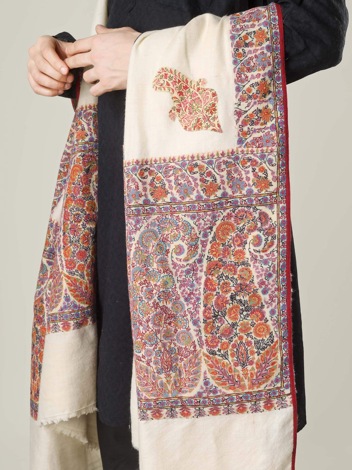 Antique Kashmiri kalamkari sozni men’s shawl with intricate multicolour paisley and floral embroidery on ivory pashmina, draped over a black kurta, handcrafted luxury wedding shawl from Kashmir.
    
      | pashmina shawls online | authentic Kashmiri pashmina shawl online | pure pashmina shawl online | original GI certified pashmina shawl online | luxury men's pashmina shawl online from Kashmir | where to buy online pure pashmina in India
    
    | GI Tag Certified - Government-verified authentic Kashmiri Pashmina
    | G20 Official Partner - Selected by India for G20 Summit gifting
    | Handicraft Registered - Official recognition of traditional craftsmanship
    | Certificate of Authenticity - Every purchase includes GI certification