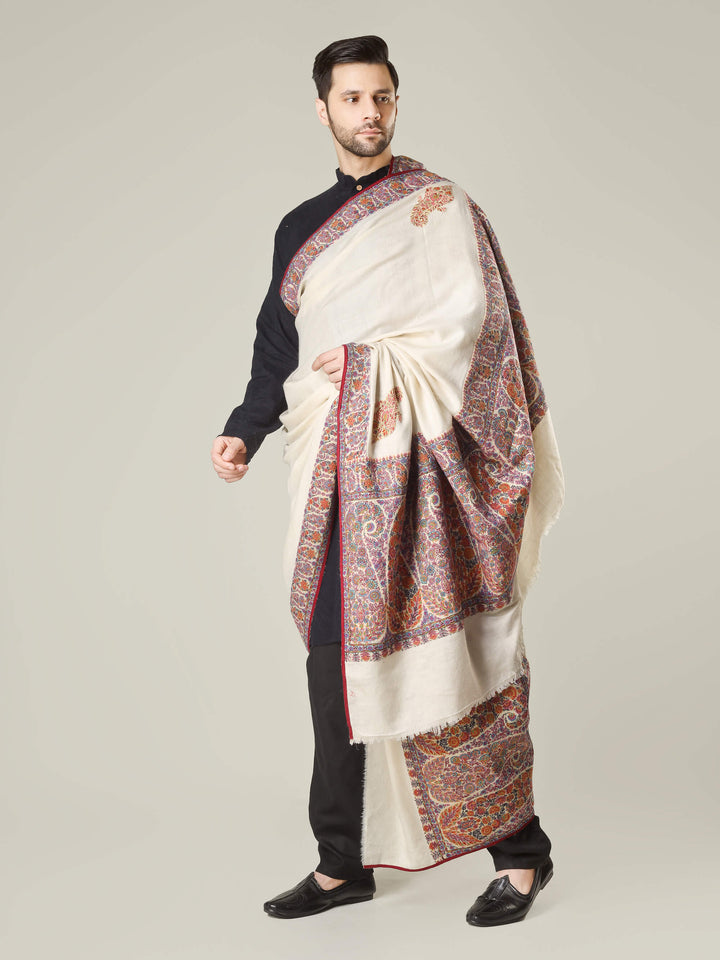 Antique Kashmiri kalamkari sozni men’s shawl with intricate multicolour paisley and floral embroidery on ivory pashmina, draped over a black kurta, handcrafted luxury wedding shawl from Kashmir.
    
      | pashmina shawls online | authentic Kashmiri pashmina shawl online | pure pashmina shawl online | original GI certified pashmina shawl online | luxury men's pashmina shawl online from Kashmir | where to buy online pure pashmina in India
    
    | GI Tag Certified - Government-verified authentic Kashmiri Pashmina
    | G20 Official Partner - Selected by India for G20 Summit gifting
    | Handicraft Registered - Official recognition of traditional craftsmanship
    | Certificate of Authenticity - Every purchase includes GI certification