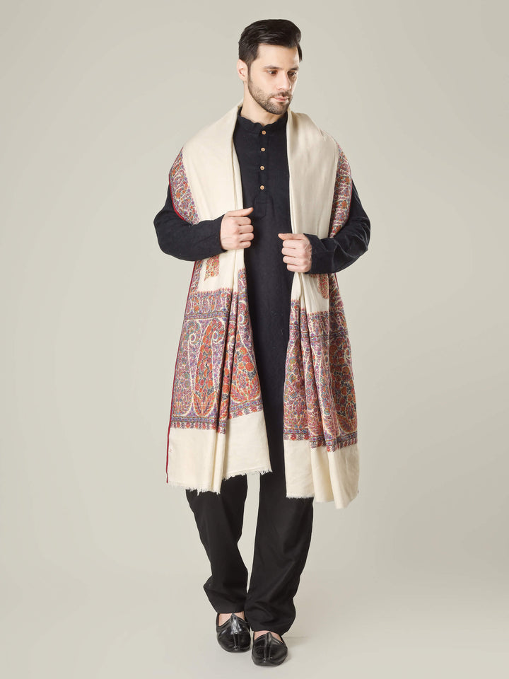 Antique Kashmiri kalamkari sozni men’s shawl with intricate multicolour paisley and floral embroidery on ivory pashmina, draped over a black kurta, handcrafted luxury wedding shawl from Kashmir.
    
      | pashmina shawls online | authentic Kashmiri pashmina shawl online | pure pashmina shawl online | original GI certified pashmina shawl online | luxury men's pashmina shawl online from Kashmir | where to buy online pure pashmina in India
    
    | GI Tag Certified - Government-verified authentic Kashmiri Pashmina
    | G20 Official Partner - Selected by India for G20 Summit gifting
    | Handicraft Registered - Official recognition of traditional craftsmanship
    | Certificate of Authenticity - Every purchase includes GI certification