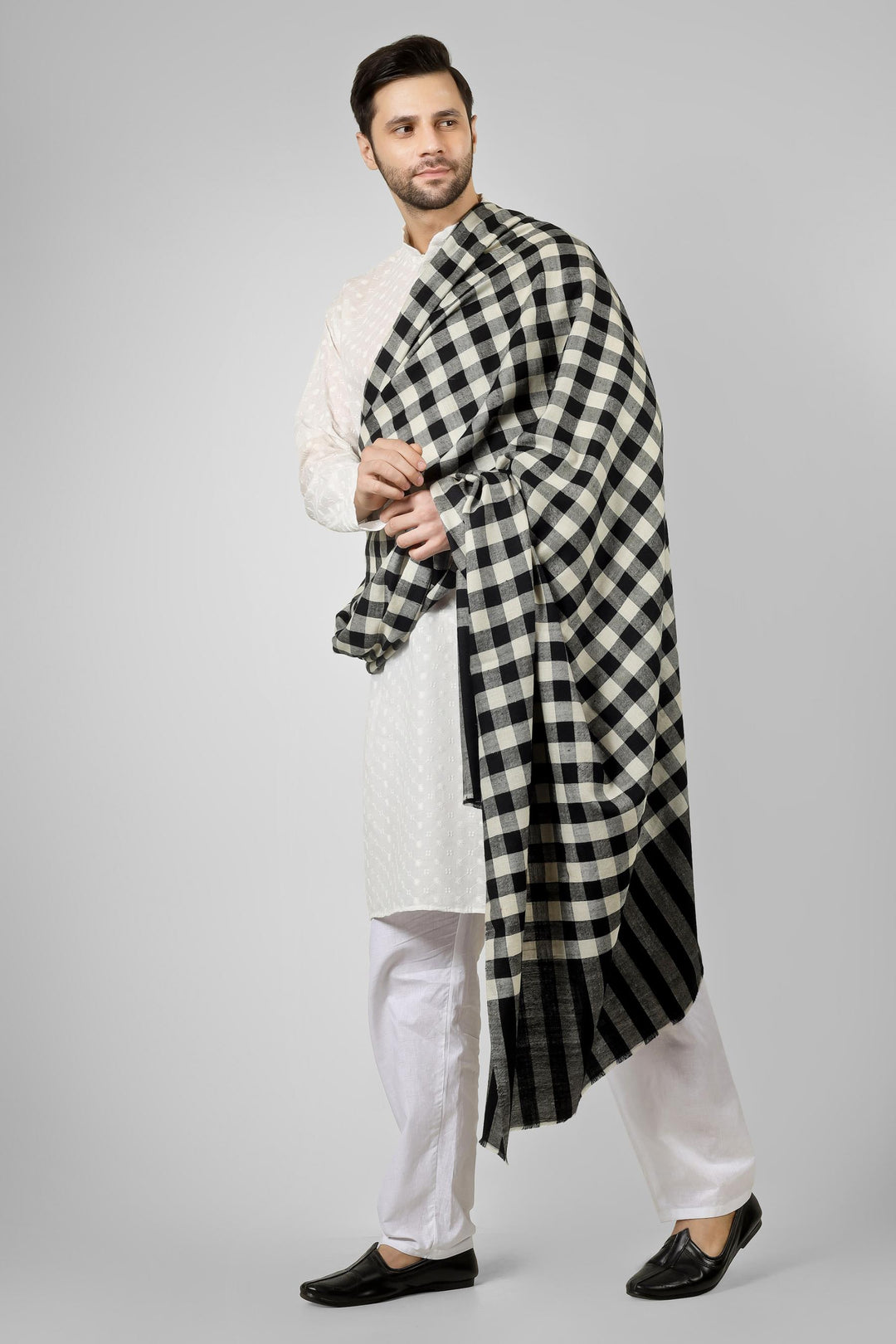 Ideal for gentlemen worldwide seeking distinctive men's pashmina shawls in the USA, Canada, UK, Europe and Middle East, this checkered black and white pashmina shawl offers authentic Kashmiri craftsmanship for bold fashion statements.