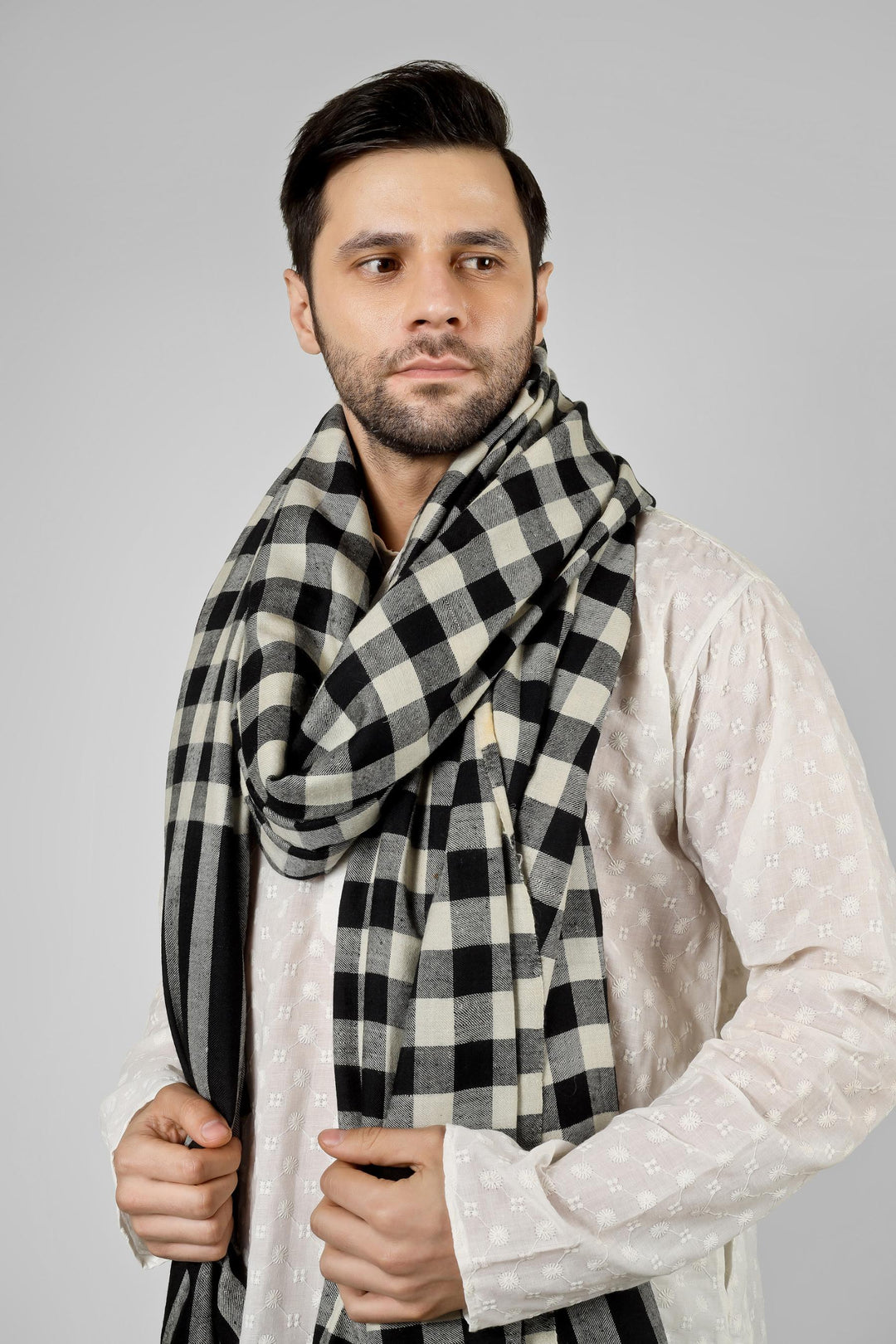 Ideal for gentlemen worldwide seeking distinctive men's pashmina shawls in the USA, Canada, UK, Europe and Middle East, this checkered black and white pashmina shawl offers authentic Kashmiri craftsmanship for bold fashion statements.