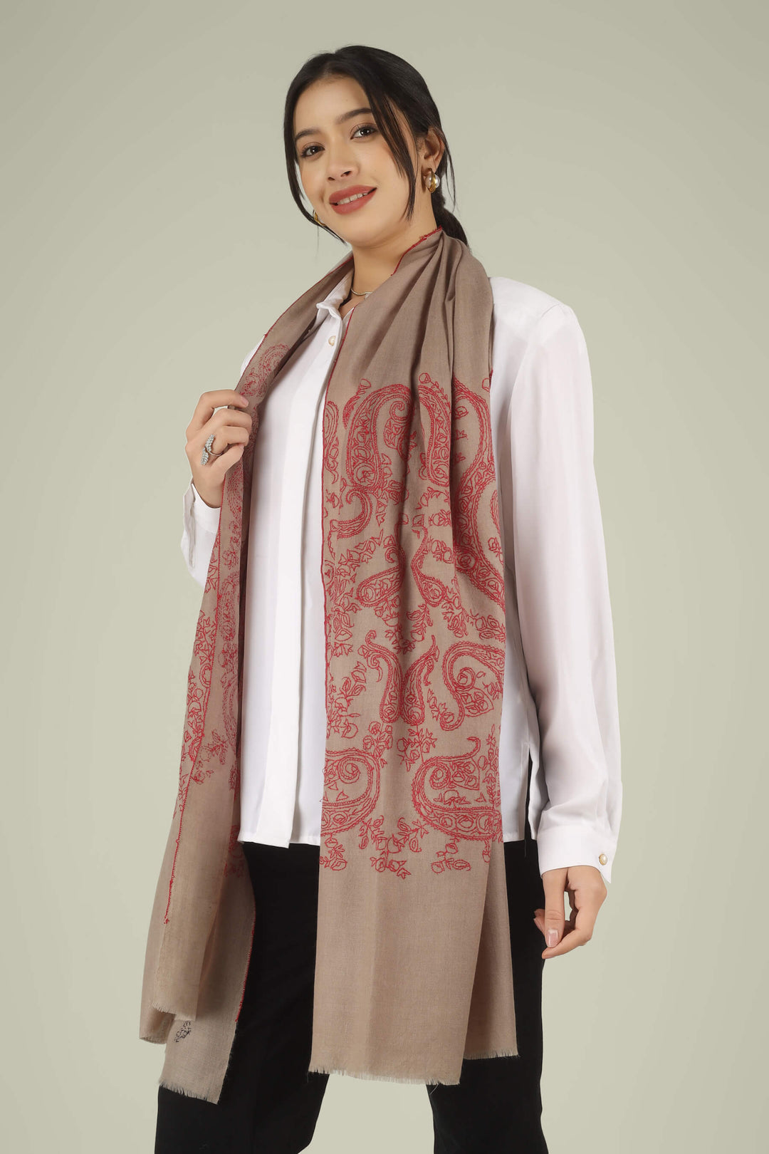 Hand-embroidered natural taupe pure Pashmina stole featuring oversized crimson-red Sozni paisley (Buta) motifs on the end panels from Kepra.