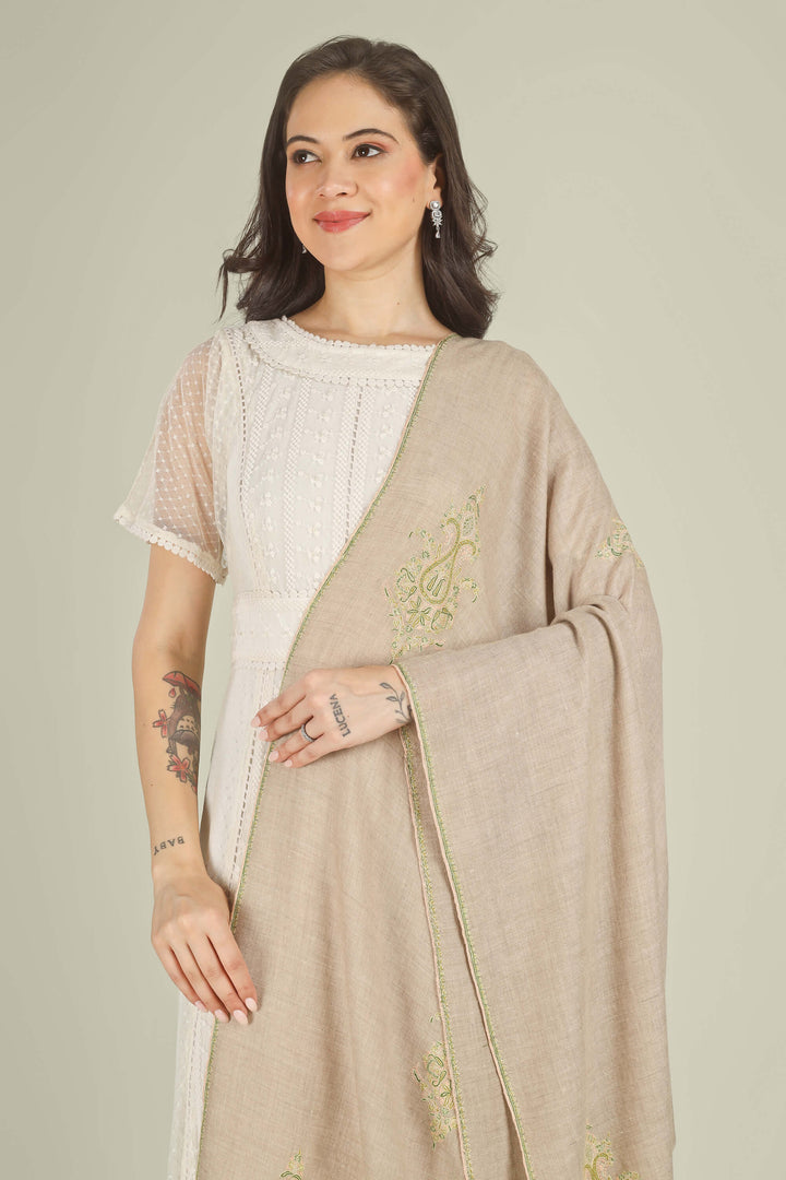 A woman modeling a traditional outfit featuring a light beige linen dupatta with gold embroidery draped over a white embroidered kurta, set against a solid light gray background.
    
      | pashmina shawls online | authentic Kashmiri pashmina shawl online | pure pashmina shawl online | original GI certified pashmina shawl online | luxury men's pashmina shawl online from Kashmir | where to buy online pure pashmina in India
    
    | GI Tag Certified - Government-verified authentic Kashmiri Pashmina
    | G20 Official Partner - Selected by India for G20 Summit gifting
    | Handicraft Registered - Official recognition of traditional craftsmanship
    | Certificate of Authenticity - Every purchase includes GI certification