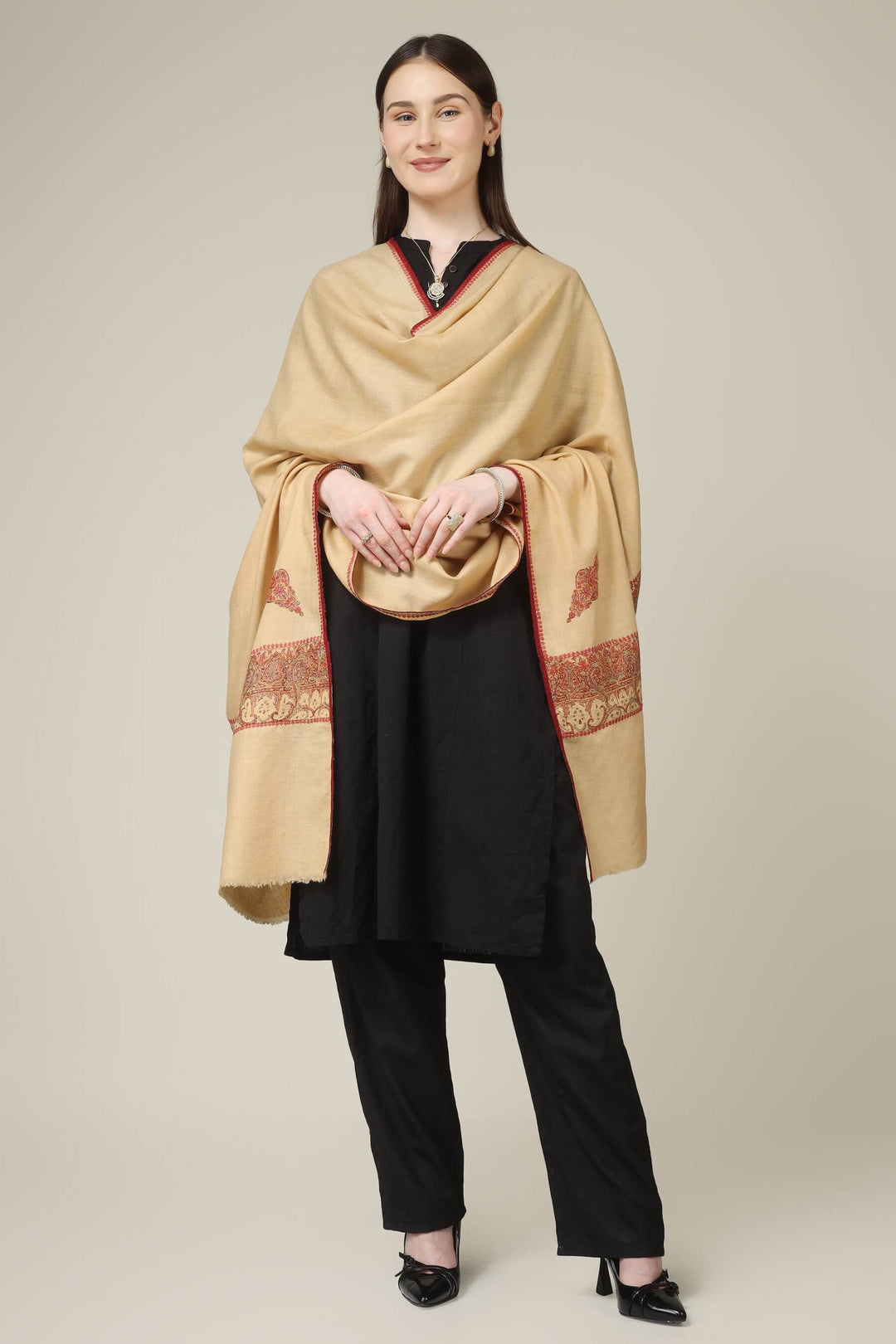 This antique sozni jamawar shawl, also known as an amli jamawar, is crafted on pure pashmina and finished with a beautifully patched heritage border in rich red and gold tones