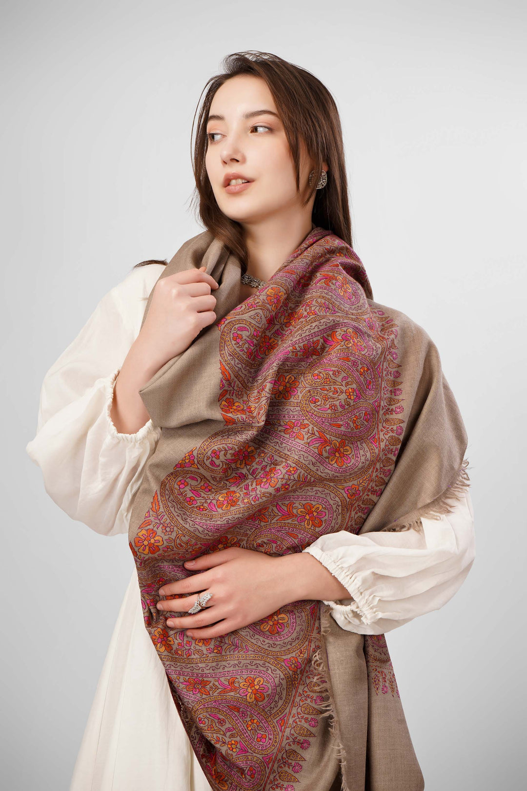 Natural Pashmina Sozni Shawls Online – Heritage Artistry in Earthy Tones
   The Pashmina Natural Paldaar Sozni Shawl is a fine example of Kashmiri handloom luxury. Woven from pure, undyed “toosh” (natural beige) pashmina, the shawl is highlighted by intricate sozni embroidery on both pallus (ends)