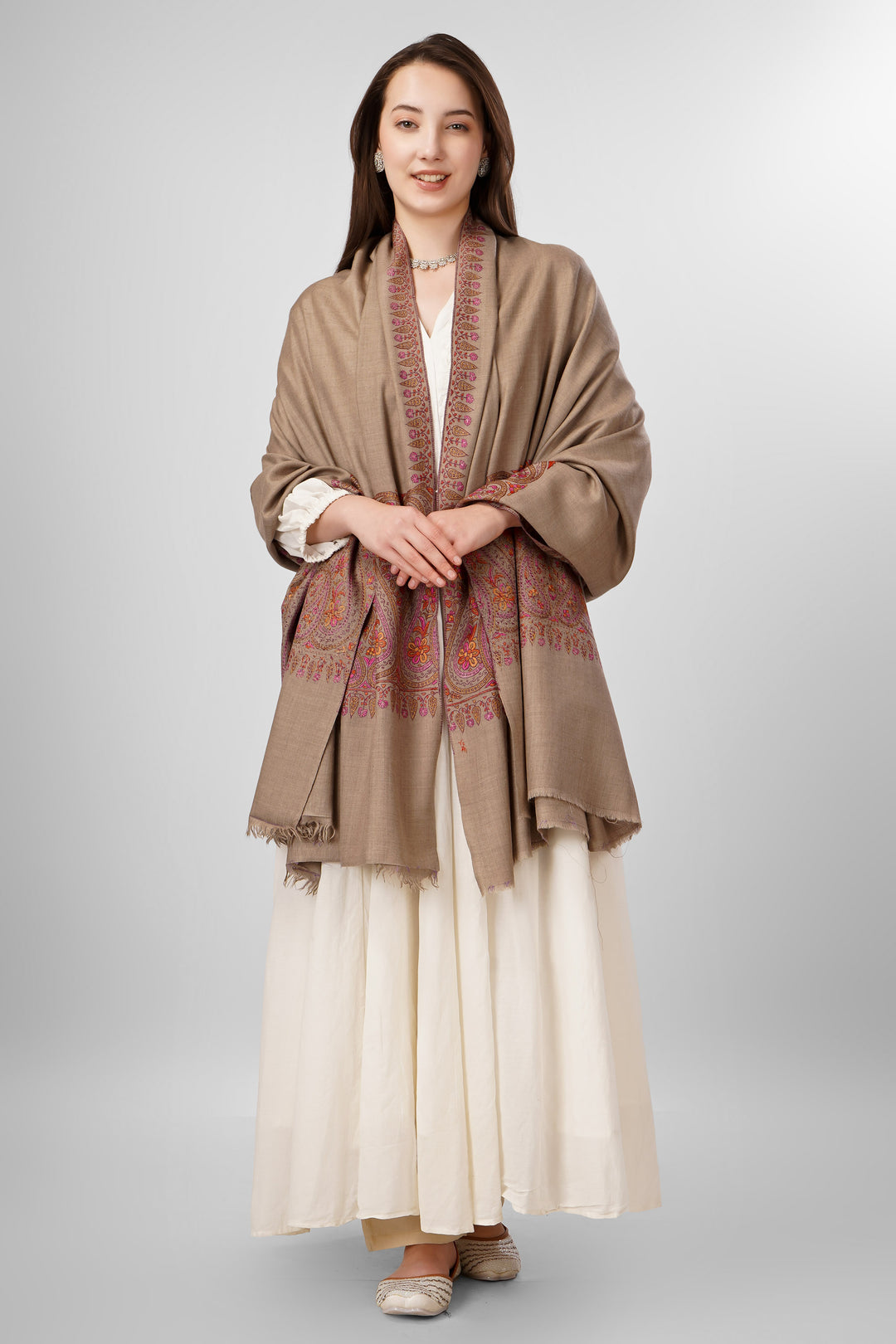 Natural Pashmina Sozni Shawls Online – Heritage Artistry in Earthy Tones
   The Pashmina Natural Paldaar Sozni Shawl is a fine example of Kashmiri handloom luxury. Woven from pure, undyed “toosh” (natural beige) pashmina, the shawl is highlighted by intricate sozni embroidery on both pallus (ends)