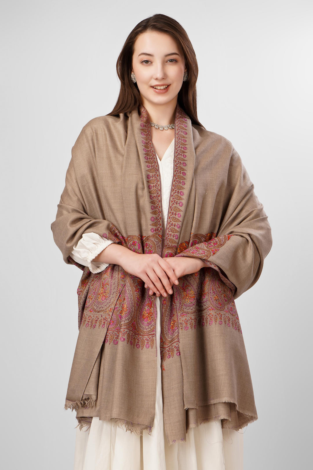 Natural Pashmina Sozni Shawls Online – Heritage Artistry in Earthy Tones
   The Pashmina Natural Paldaar Sozni Shawl is a fine example of Kashmiri handloom luxury. Woven from pure, undyed “toosh” (natural beige) pashmina, the shawl is highlighted by intricate sozni embroidery on both pallus (ends)