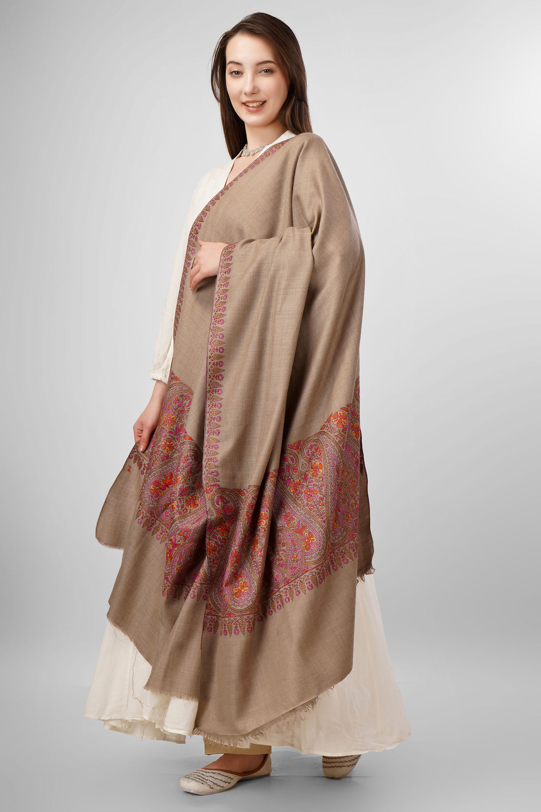 Natural Pashmina Sozni Shawls Online – Heritage Artistry in Earthy Tones
   The Pashmina Natural Paldaar Sozni Shawl is a fine example of Kashmiri handloom luxury. Woven from pure, undyed “toosh” (natural beige) pashmina, the shawl is highlighted by intricate sozni embroidery on both pallus (ends)