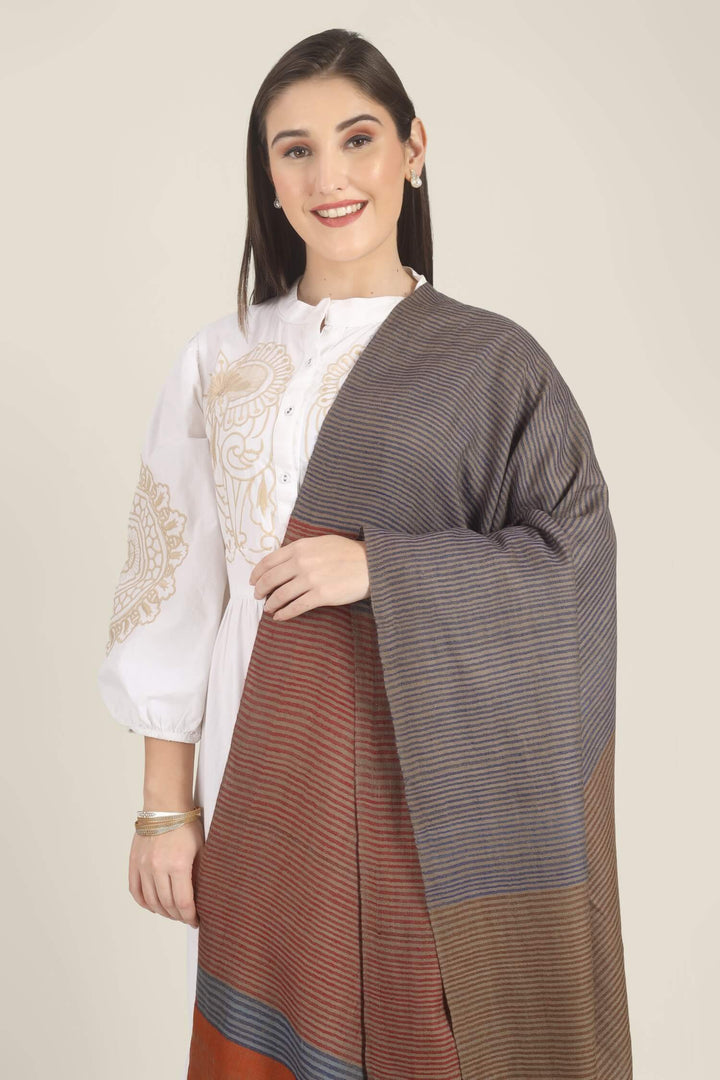 Model draped in a multicolour Pure Kashmiri Pashmina shawl with woven grey-blue, rust-red and taupe stripes and a wide plain rust border over a white embroidered dress.
    
      | pashmina shawls online | authentic Kashmiri pashmina shawl online | pure pashmina shawl online | original GI certified pashmina shawl online | luxury men's pashmina shawl online from Kashmir | where to buy online pure pashmina in India
    
    | GI Tag Certified - Government-verified authentic Kashmiri Pashmina
    | G20 Official Partner - Selected by India for G20 Summit gifting
    | Handicraft Registered - Official recognition of traditional craftsmanship
    | Certificate of Authenticity - Every purchase includes GI certification