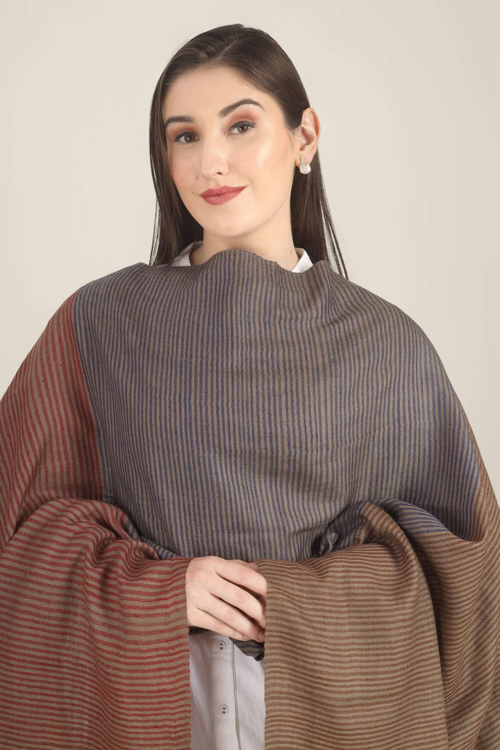 Model draped in a multicolour Pure Kashmiri Pashmina shawl with woven grey-blue, rust-red and taupe stripes and a wide plain rust border over a white embroidered dress.
    
      | pashmina shawls online | authentic Kashmiri pashmina shawl online | pure pashmina shawl online | original GI certified pashmina shawl online | luxury men's pashmina shawl online from Kashmir | where to buy online pure pashmina in India
    
    | GI Tag Certified - Government-verified authentic Kashmiri Pashmina
    | G20 Official Partner - Selected by India for G20 Summit gifting
    | Handicraft Registered - Official recognition of traditional craftsmanship
    | Certificate of Authenticity - Every purchase includes GI certification