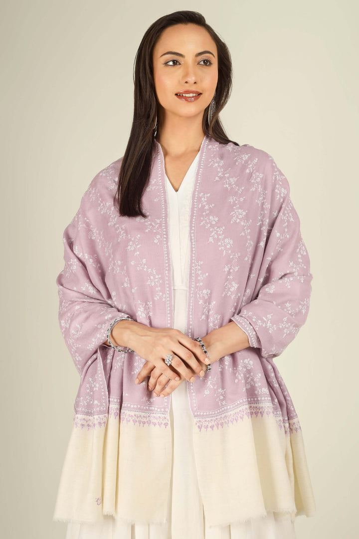 Lilac Kashmiri pure pashmina embroidered stole with cream base by Kepra, worn over white dress, front view for Rome winter styling
    
      | pashmina shawls online | authentic Kashmiri pashmina shawl online | pure pashmina shawl online | original GI certified pashmina shawl online | luxury men's pashmina shawl online from Kashmir | where to buy online pure pashmina in India
    
    | GI Tag Certified - Government-verified authentic Kashmiri Pashmina
    | G20 Official Partner - Selected by India for G20 Summit gifting
    | Handicraft Registered - Official recognition of traditional craftsmanship
    | Certificate of Authenticity - Every purchase includes GI certification