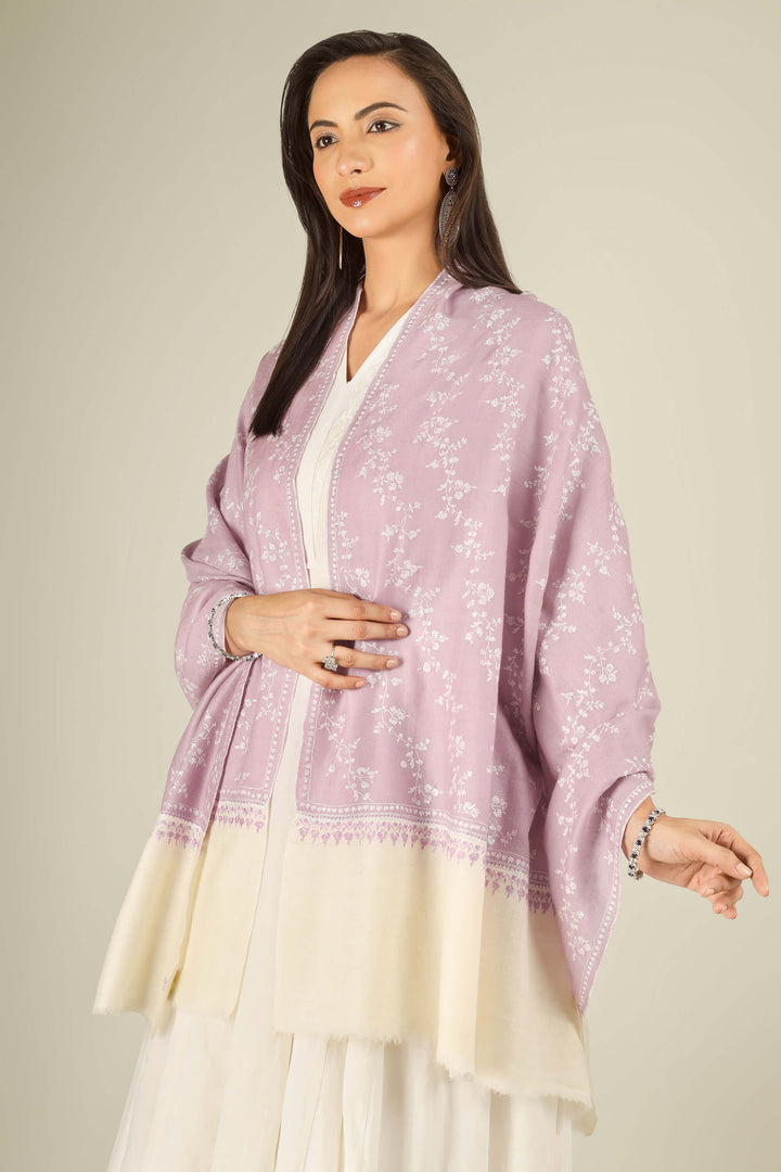 Lilac Kashmiri pure pashmina embroidered stole with cream base by Kepra, worn over white dress, front view for Rome winter styling
    
      | pashmina shawls online | authentic Kashmiri pashmina shawl online | pure pashmina shawl online | original GI certified pashmina shawl online | luxury men's pashmina shawl online from Kashmir | where to buy online pure pashmina in India
    
    | GI Tag Certified - Government-verified authentic Kashmiri Pashmina
    | G20 Official Partner - Selected by India for G20 Summit gifting
    | Handicraft Registered - Official recognition of traditional craftsmanship
    | Certificate of Authenticity - Every purchase includes GI certification