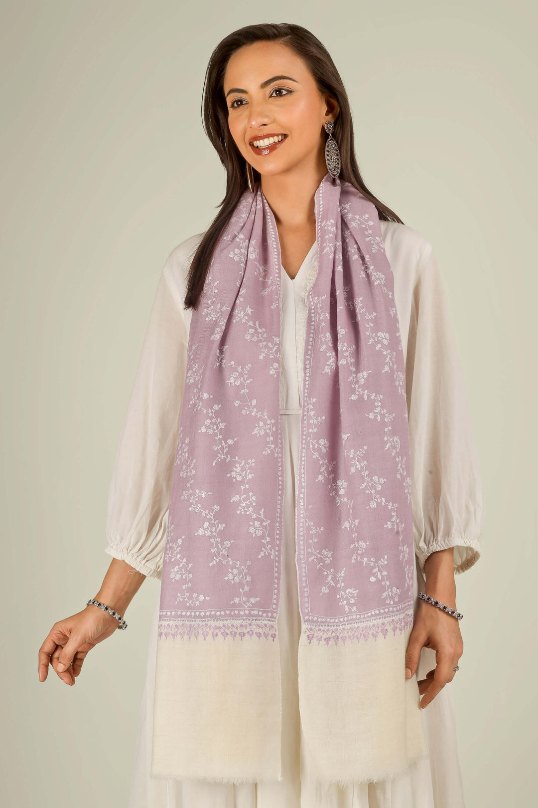 Lilac Kashmiri pure pashmina embroidered stole with cream base by Kepra, worn over white dress, front view for Rome winter styling