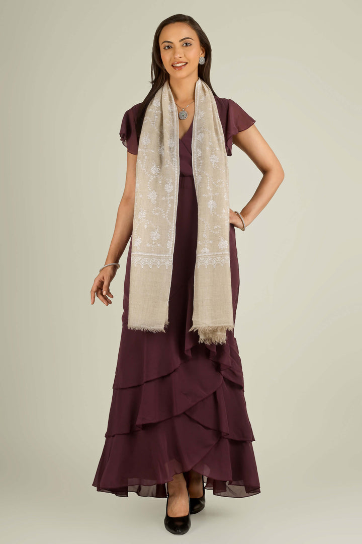 Beige GI Kashmiri pure pashmina embroidered stole by Kepra, draped on smiling model over plum dress, front view for Vienna winter styling
    
      | pashmina shawls online | authentic Kashmiri pashmina shawl online | pure pashmina shawl online | original GI certified pashmina shawl online | luxury men's pashmina shawl online from Kashmir | where to buy online pure pashmina in India
    
    | GI Tag Certified - Government-verified authentic Kashmiri Pashmina
    | G20 Official Partner - Selected by India for G20 Summit gifting
    | Handicraft Registered - Official recognition of traditional craftsmanship
    | Certificate of Authenticity - Every purchase includes GI certification