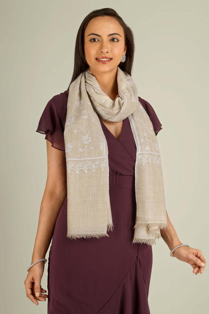 Beige GI Kashmiri pure pashmina embroidered stole by Kepra, draped on smiling model over plum dress, front view for Vienna winter styling
    
      | pashmina shawls online | authentic Kashmiri pashmina shawl online | pure pashmina shawl online | original GI certified pashmina shawl online | luxury men's pashmina shawl online from Kashmir | where to buy online pure pashmina in India
    
    | GI Tag Certified - Government-verified authentic Kashmiri Pashmina
    | G20 Official Partner - Selected by India for G20 Summit gifting
    | Handicraft Registered - Official recognition of traditional craftsmanship
    | Certificate of Authenticity - Every purchase includes GI certification