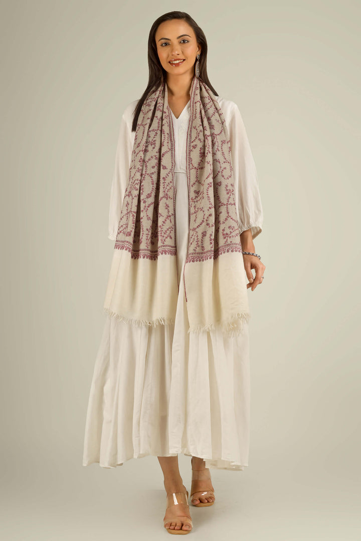 Close-up of beige Kashmiri pure pashmina stole with red sozni vine embroidery, held at the front, detail view for Berlin winter styling
    
      | pashmina shawls online | authentic Kashmiri pashmina shawl online | pure pashmina shawl online | original GI certified pashmina shawl online | luxury men's pashmina shawl online from Kashmir | where to buy online pure pashmina in India
    
    | GI Tag Certified - Government-verified authentic Kashmiri Pashmina
    | G20 Official Partner - Selected by India for G20 Summit gifting
    | Handicraft Registered - Official recognition of traditional craftsmanship
    | Certificate of Authenticity - Every purchase includes GI certification