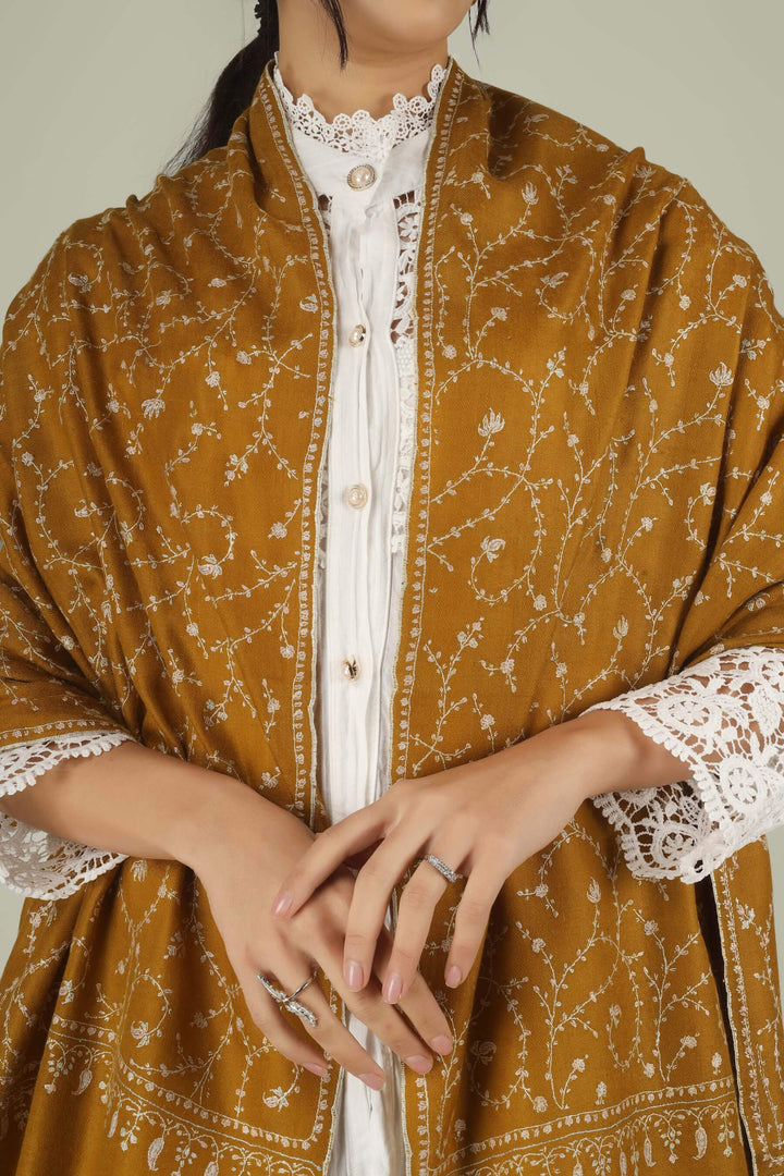 Hand-embroidered mustard gold pure Pashmina stole with ivory-white Jaldaar Sozni floral vine embroidery from Kepra.
    
      | pashmina shawls online | authentic Kashmiri pashmina shawl online | pure pashmina shawl online | original GI certified pashmina shawl online | luxury men's pashmina shawl online from Kashmir | where to buy online pure pashmina in India
    
    | GI Tag Certified - Government-verified authentic Kashmiri Pashmina
    | G20 Official Partner - Selected by India for G20 Summit gifting
    | Handicraft Registered - Official recognition of traditional craftsmanship
    | Certificate of Authenticity - Every purchase includes GI certification