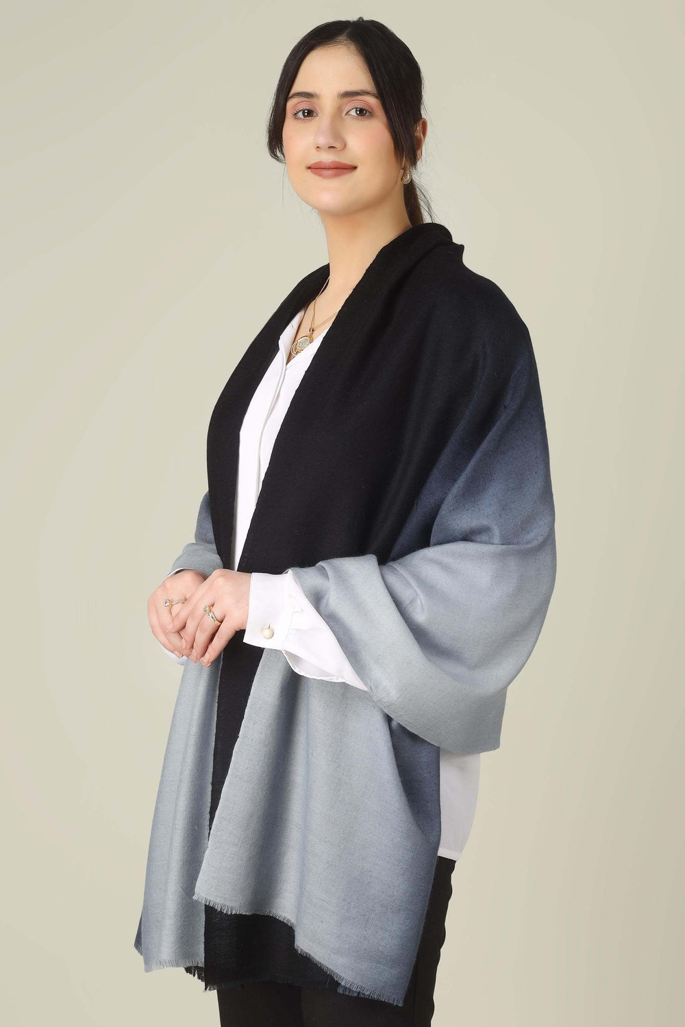 Ideal for customers searching for pashmina online, this black and grey ombre stole is a smart choice for boardrooms and business trips from India to Germany.