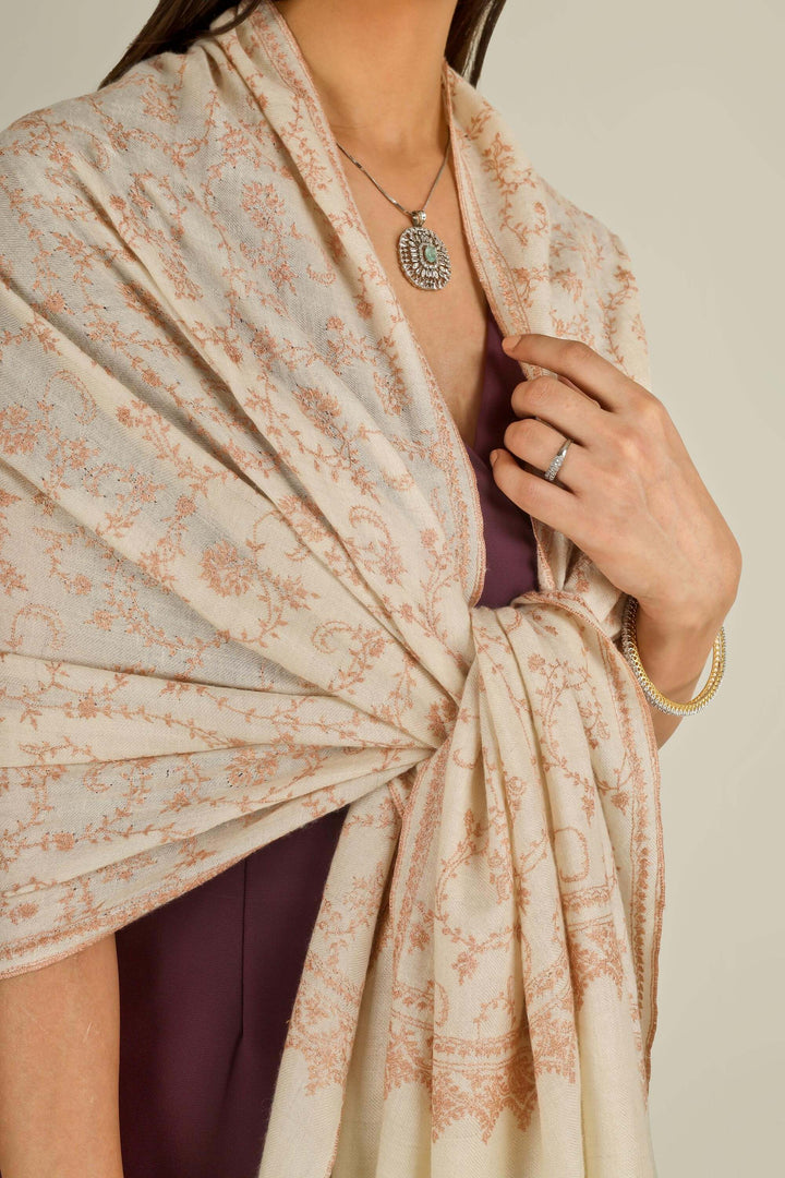 Close-up of beige Kashmiri pure pashmina sozni embroidered stole with red vines, held at the front, detail view for Amsterdam winter styling
    
      | pashmina shawls online | authentic Kashmiri pashmina shawl online | pure pashmina shawl online | original GI certified pashmina shawl online | luxury men's pashmina shawl online from Kashmir | where to buy online pure pashmina in India
    
    | GI Tag Certified - Government-verified authentic Kashmiri Pashmina
    | G20 Official Partner - Selected by India for G20 Summit gifting
    | Handicraft Registered - Official recognition of traditional craftsmanship
    | Certificate of Authenticity - Every purchase includes GI certification