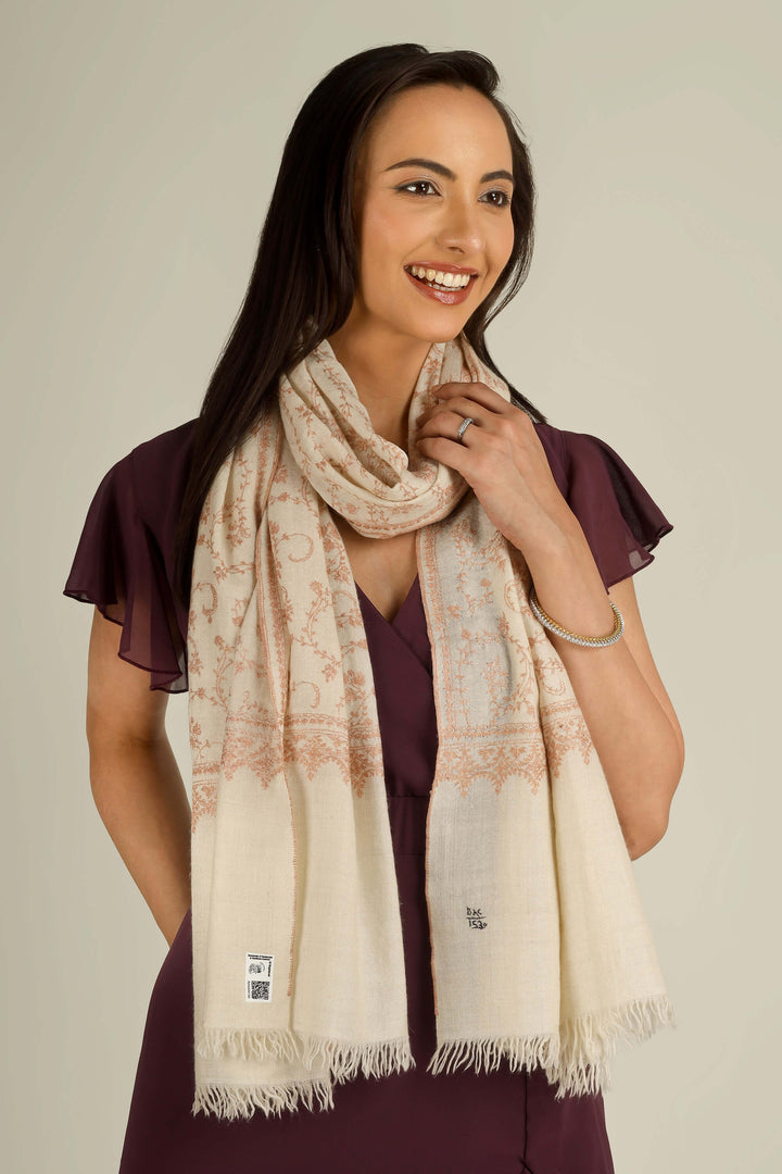 Close-up of beige Kashmiri pure pashmina sozni embroidered stole with red vines, held at the front, detail view for Amsterdam winter styling
    
      | pashmina shawls online | authentic Kashmiri pashmina shawl online | pure pashmina shawl online | original GI certified pashmina shawl online | luxury men's pashmina shawl online from Kashmir | where to buy online pure pashmina in India
    
    | GI Tag Certified - Government-verified authentic Kashmiri Pashmina
    | G20 Official Partner - Selected by India for G20 Summit gifting
    | Handicraft Registered - Official recognition of traditional craftsmanship
    | Certificate of Authenticity - Every purchase includes GI certification
