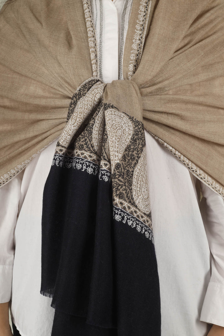 Hand-embroidered beige and black dual-tone pure Pashmina stole with ivory Sozni paisley motifs on the borders from Kepra
    
      | pashmina shawls online | authentic Kashmiri pashmina shawl online | pure pashmina shawl online | original GI certified pashmina shawl online | luxury men's pashmina shawl online from Kashmir | where to buy online pure pashmina in India
    
    | GI Tag Certified - Government-verified authentic Kashmiri Pashmina
    | G20 Official Partner - Selected by India for G20 Summit gifting
    | Handicraft Registered - Official recognition of traditional craftsmanship
    | Certificate of Authenticity - Every purchase includes GI certification