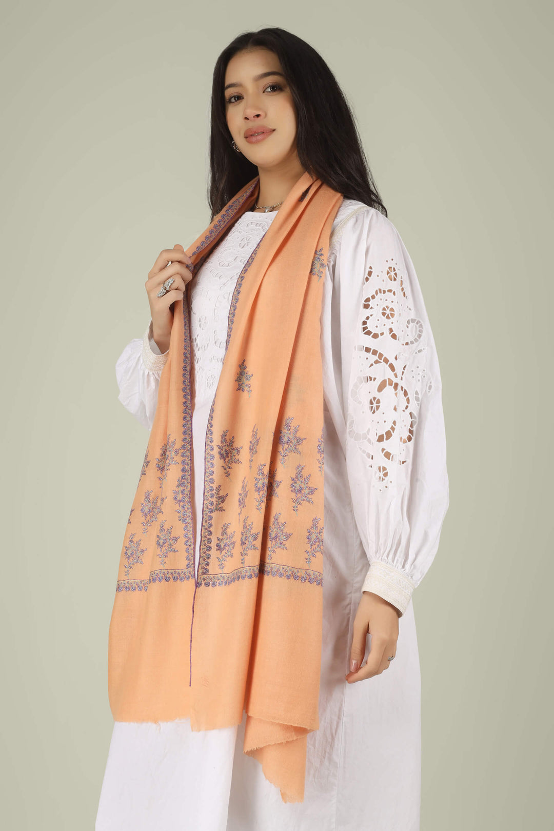 100% pure Pashmina stole, a masterpiece of Kashmiri craft that defines modern luxury. Weighing next to nothing, this feather-light accessory is hand-woven