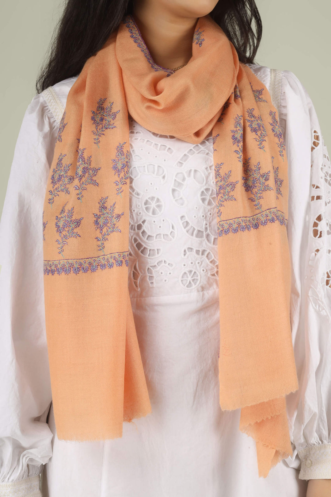 100% pure Pashmina stole, a masterpiece of Kashmiri craft that defines modern luxury. Weighing next to nothing, this feather-light accessory is hand-woven