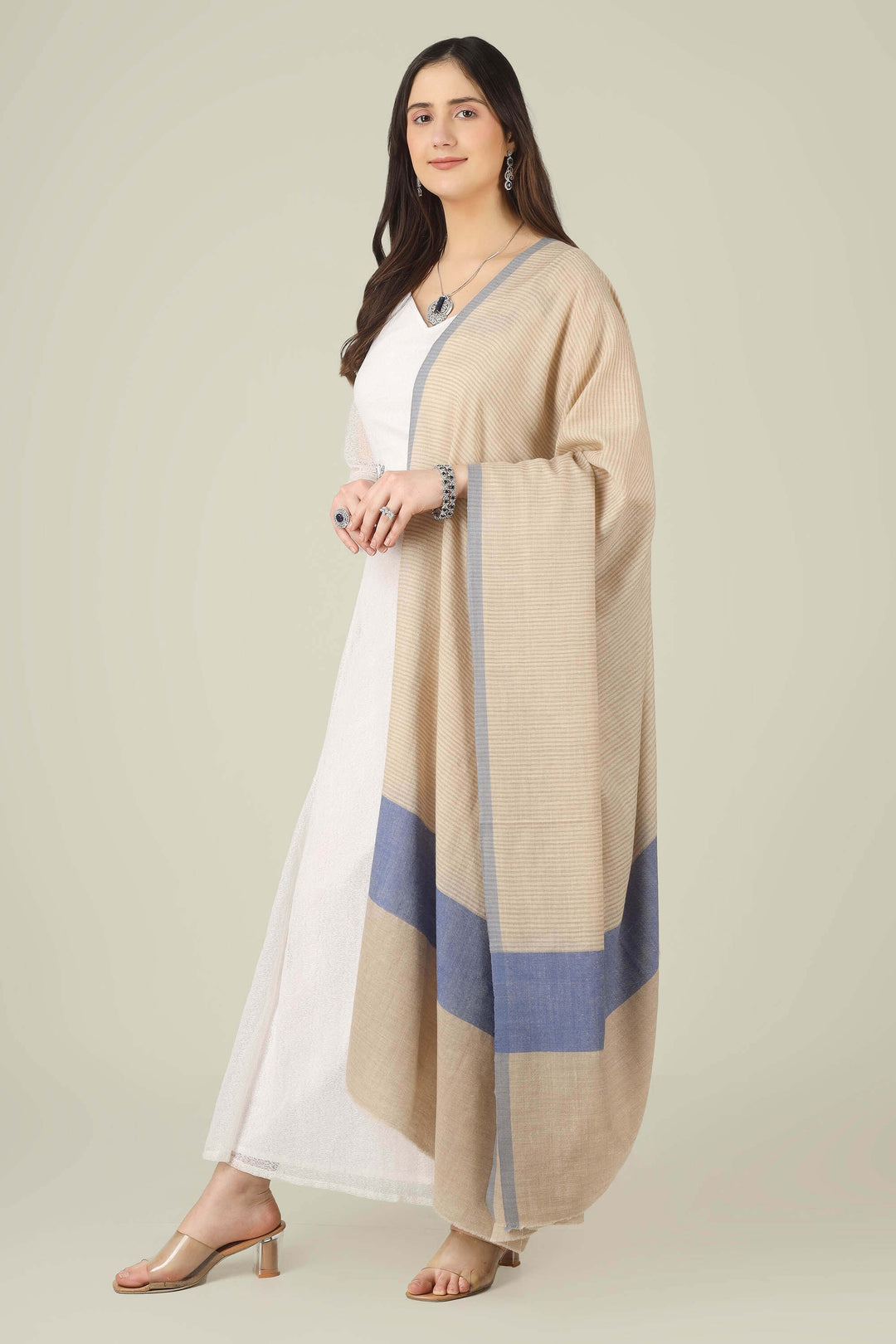 pure pashmina shawl online in India, this natural-beige piece is a wardrobe staple that works just as well with ethnic suits and saris as it does with dresses and denim.