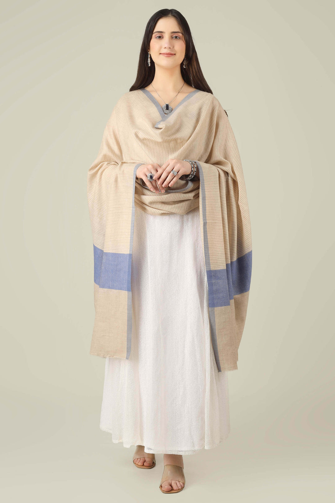 pure pashmina shawl online in India, this natural-beige piece is a wardrobe staple that works just as well with ethnic suits and saris as it does with dresses and denim.