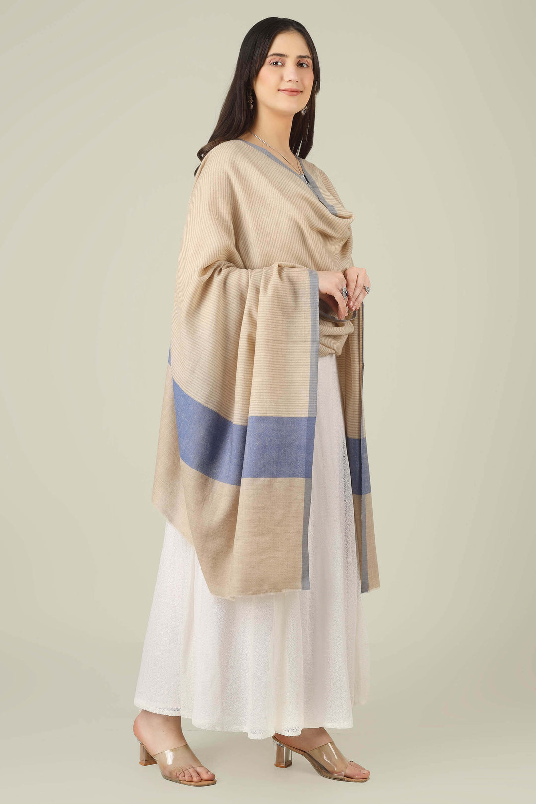 pure pashmina shawl online in India, this natural-beige piece is a wardrobe staple that works just as well with ethnic suits and saris as it does with dresses and denim.