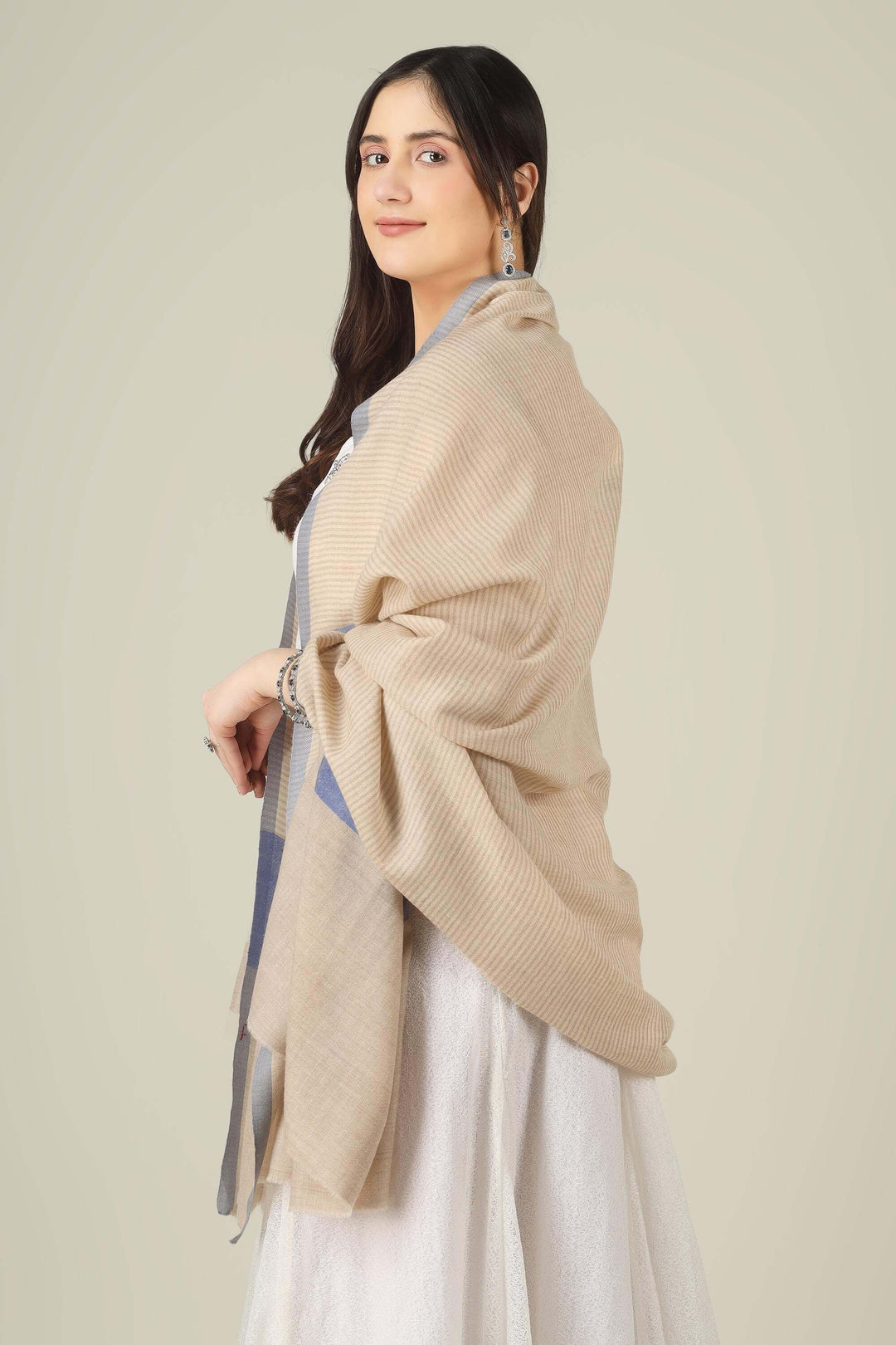 pure pashmina shawl online in India, this natural-beige piece is a wardrobe staple that works just as well with ethnic suits and saris as it does with dresses and denim.