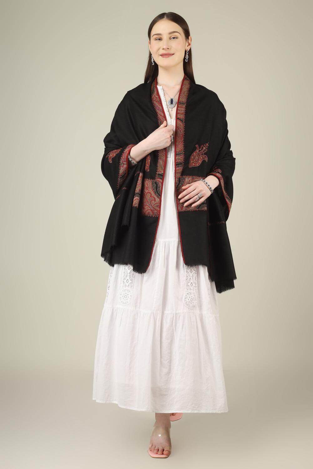 This black pure pashmina shawl is finished with an authentic antique jamawar border, carefully rescued from an old Kashmiri shawl and hand‑patched onto a freshly woven base.