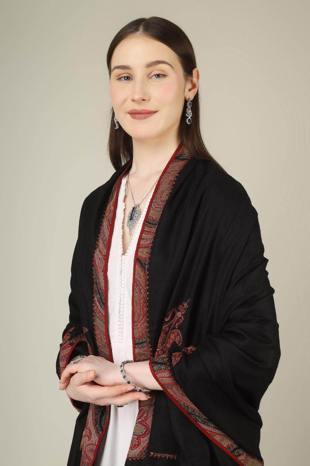This black pure pashmina shawl is finished with an authentic antique jamawar border, carefully rescued from an old Kashmiri shawl and hand‑patched onto a freshly woven base.