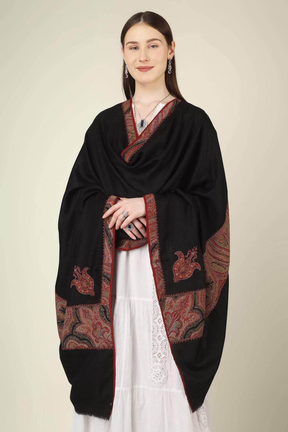 This black pure pashmina shawl is finished with an authentic antique jamawar border, carefully rescued from an old Kashmiri shawl and hand‑patched onto a freshly woven base.