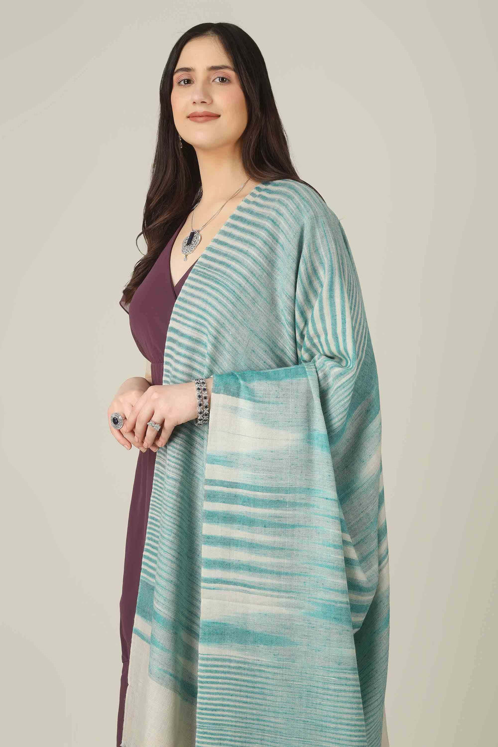 Perfect for customers searching for pashmina online, this aqua shawl brings easy elegance to wardrobes from Kashmir to style-conscious cities in Switzerland