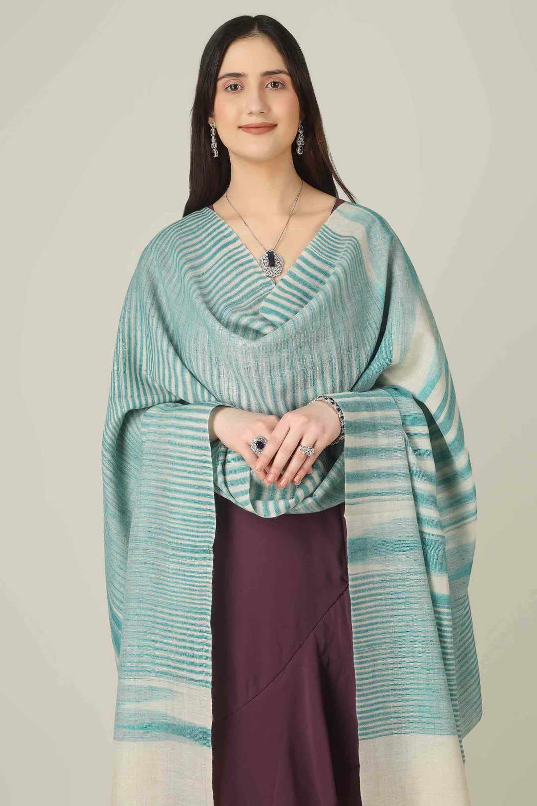 Perfect for customers searching for pashmina online, this aqua shawl brings easy elegance to wardrobes from Kashmir to style-conscious cities in Switzerland