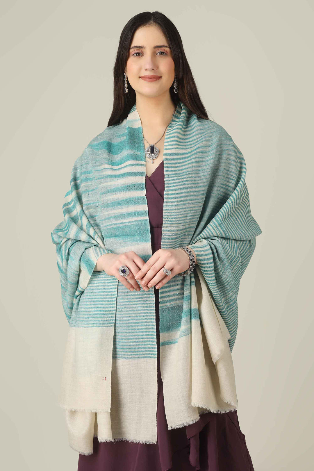 Perfect for customers searching for pashmina online, this aqua shawl brings easy elegance to wardrobes from Kashmir to style-conscious cities in Switzerland