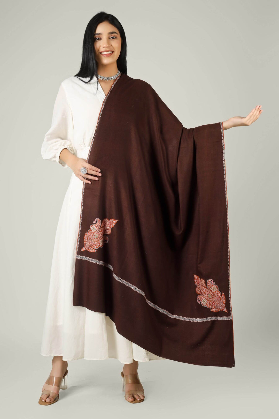 Ideal for admirers of luxury pashmina shawls in India and worldwide, this chocolate brown paisley  pashmina shawl layers effortlessly over Indian and Western outfits, adding timeless Kashmiri elegance to any wardrobe.