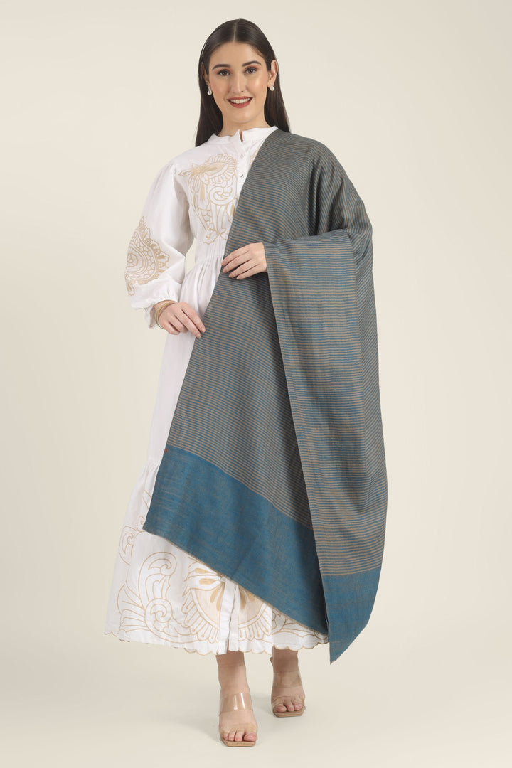 Model draped in a teal and taupe Pure Kashmiri Pashmina shawl with fine woven stripes and a wide plain teal border over a white embroidered dress.
    
      | pashmina shawls online | authentic Kashmiri pashmina shawl online | pure pashmina shawl online | original GI certified pashmina shawl online | luxury men's pashmina shawl online from Kashmir | where to buy online pure pashmina in India
    
    | GI Tag Certified - Government-verified authentic Kashmiri Pashmina
    | G20 Official Partner - Selected by India for G20 Summit gifting
    | Handicraft Registered - Official recognition of traditional craftsmanship
    | Certificate of Authenticity - Every purchase includes GI certification