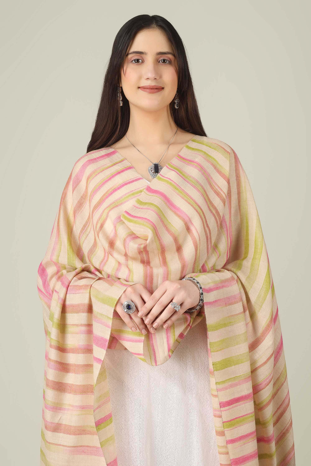 This pure pashmina shawl features a natural beige base scattered with fine horizontal stripes in blush pink, peach, and soft lime