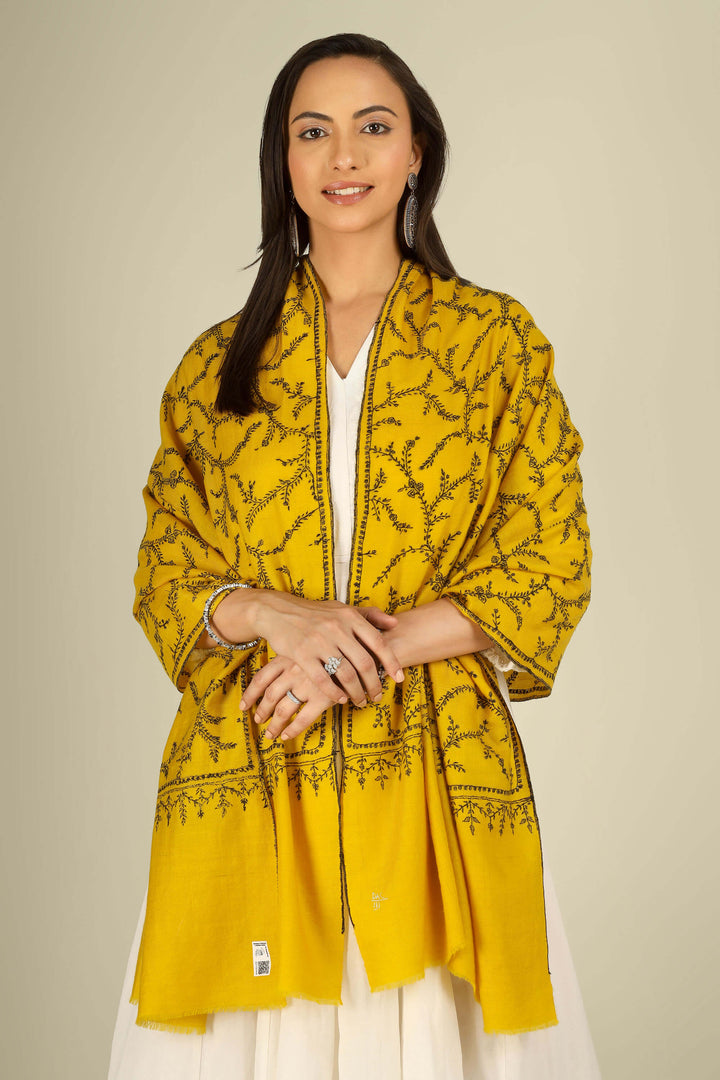 Yellow Kashmiri pure pashmina embroidered stole by Kepra, draped on smiling model in white dress, full-length front view for London winter styling
    
      | pashmina shawls online | authentic Kashmiri pashmina shawl online | pure pashmina shawl online | original GI certified pashmina shawl online | luxury men's pashmina shawl online from Kashmir | where to buy online pure pashmina in India
    
    | GI Tag Certified - Government-verified authentic Kashmiri Pashmina
    | G20 Official Partner - Selected by India for G20 Summit gifting
    | Handicraft Registered - Official recognition of traditional craftsmanship
    | Certificate of Authenticity - Every purchase includes GI certification
